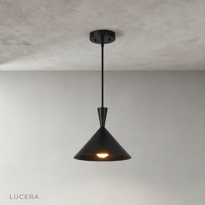 brass sconce pendant light illuminating a dark hallway with soft ambient light at dusk