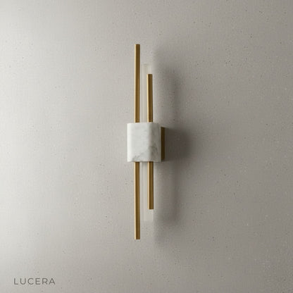 Xyloid wall lamp in crisp white finish against dark wall for contrast
