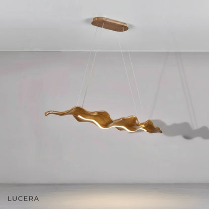 detail shot of LED strip light embedded in acrylic leaf edge of chandelier