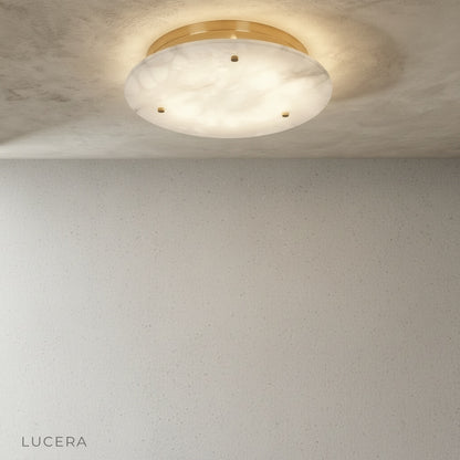 Dining area with Transom flush mount light casting warm glow over wooden table