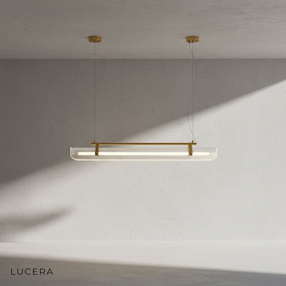 Naphthol chandelier in a cozy reading nook with leather armchair, warm ambient glow at dusk