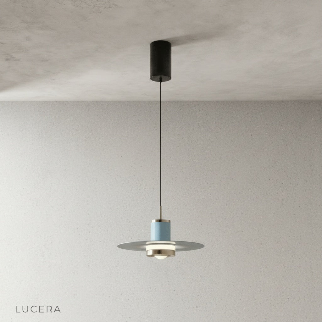 black disc pendant light with warm glow above bar counter in evening setting