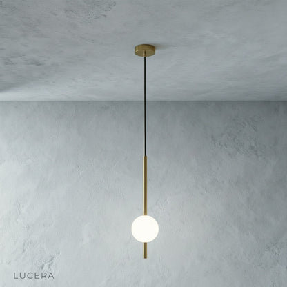 Fjord Sphere Pendant Light over wooden dining table with soft daylight