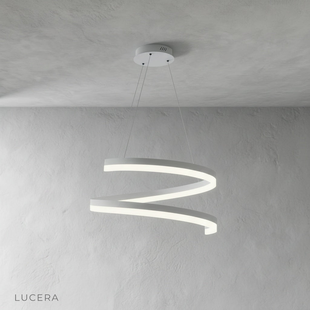 Warm ambient light from Hypnotize pendant illuminating minimalist bedroom corner