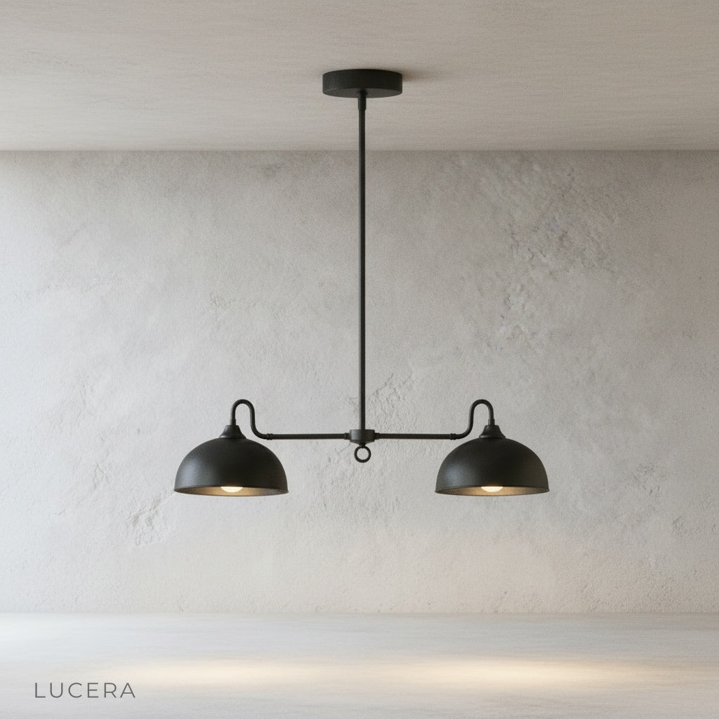 Montepulciano pendant light hanging over kitchen island with warm natural light and wooden stools