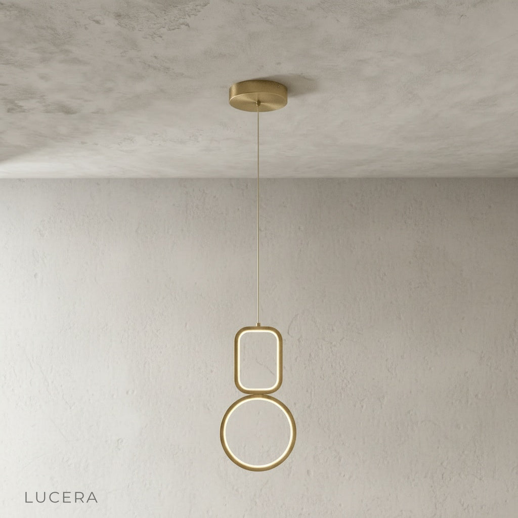 Facade pendant light in matte black finish suspended above kitchen island