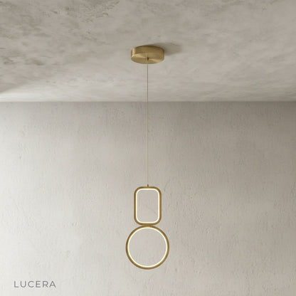 Facade pendant light in matte black finish suspended above kitchen island