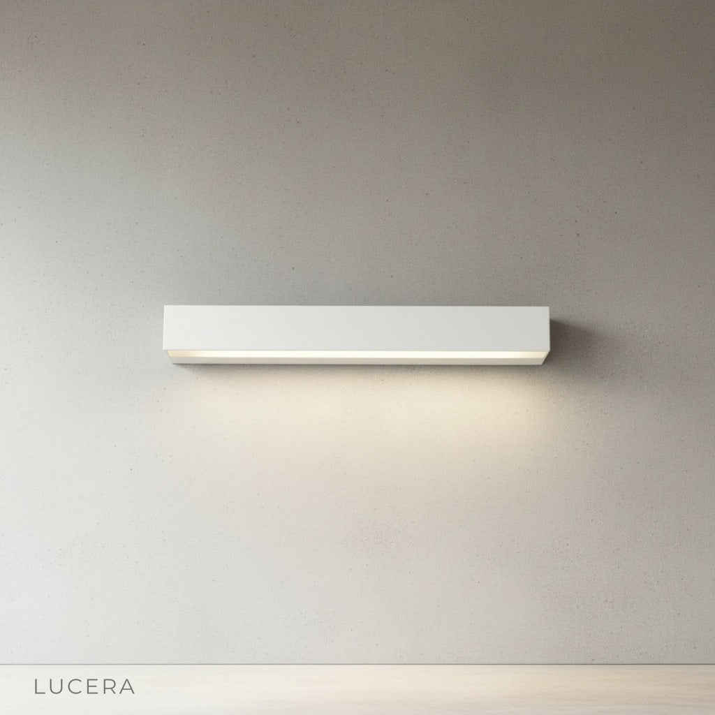 Goccia wall lamp with water-resistant casing detail, rain droplets on metal surface