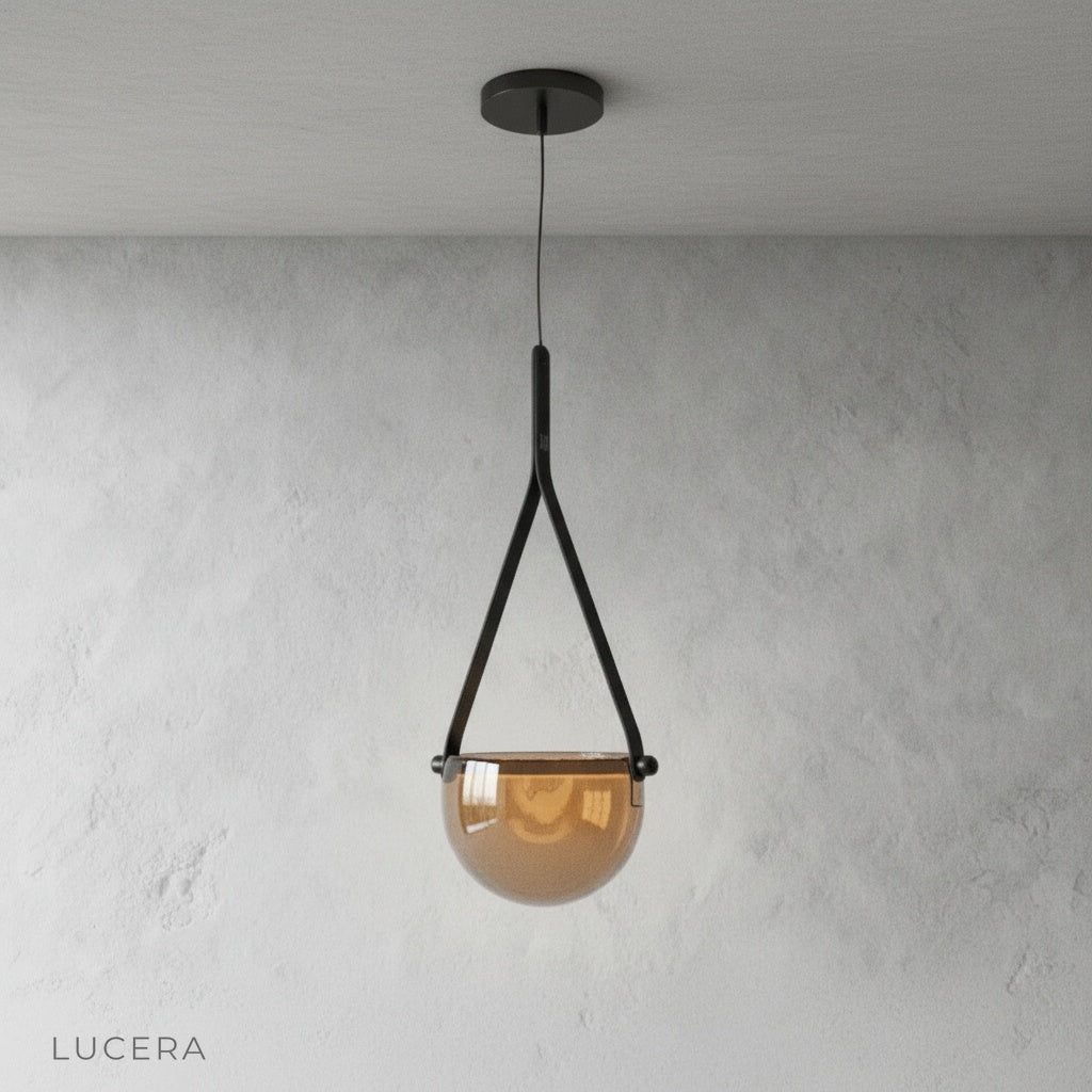 Glimmer leather pendant light hanging above a rustic wooden dining table