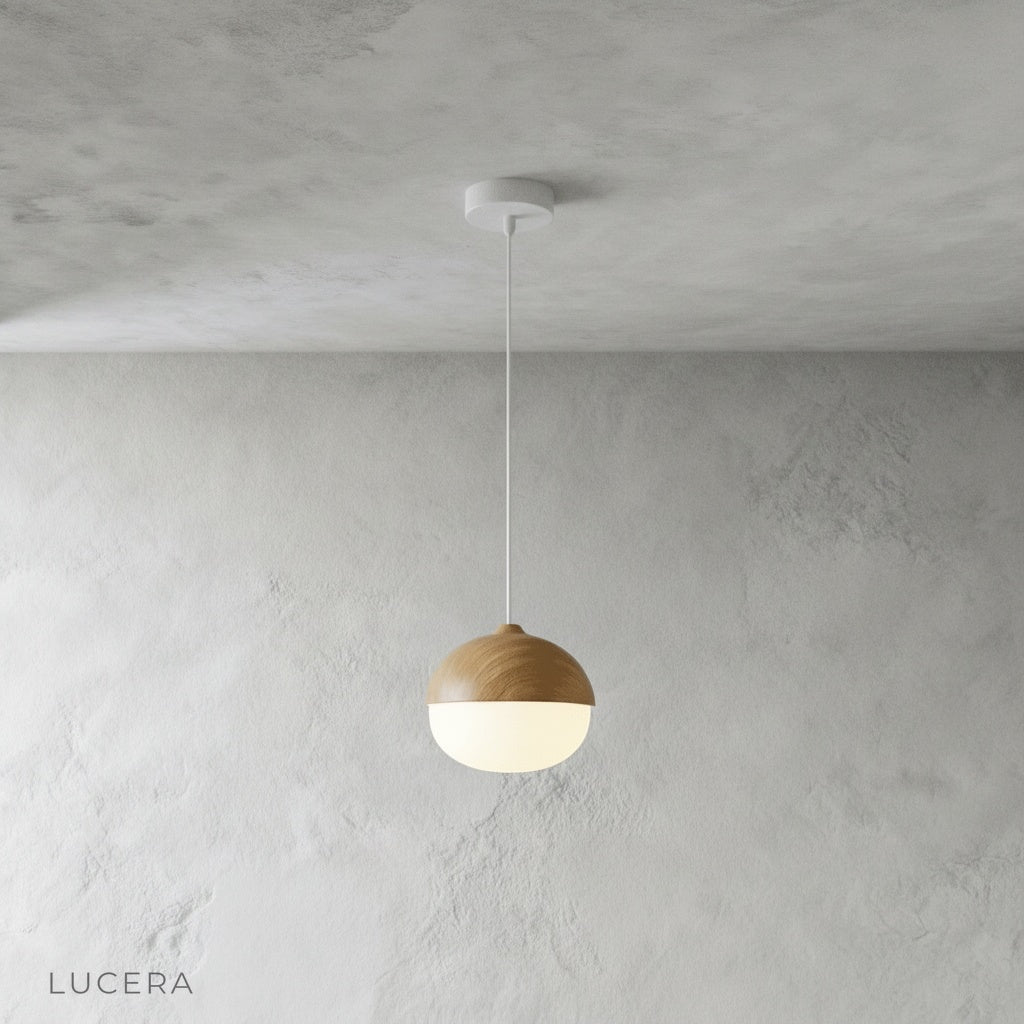 wood-look pendant light casting warm light over a cozy bedside nook with neutral bedding