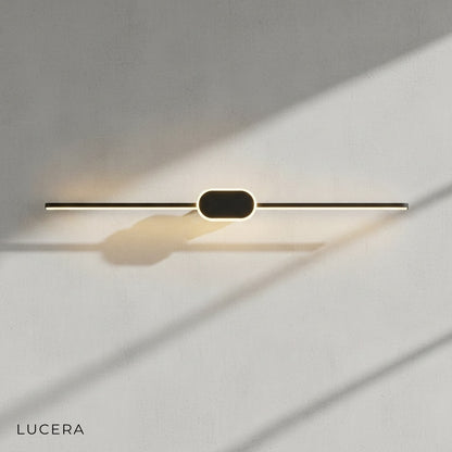 Calando LED lamp mounted above round mirror in contemporary powder room