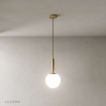 Yvaine pendant light casting soft shadows in cozy bedroom at dusk
