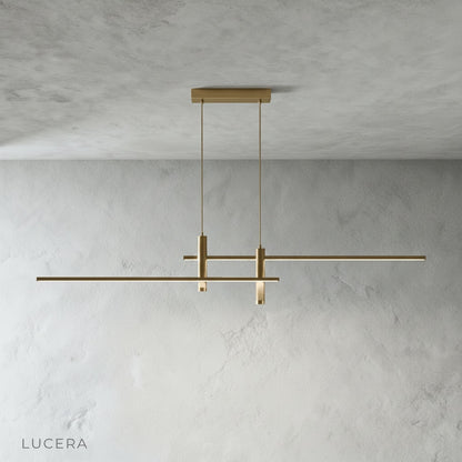 Red pendant lamp illuminating kitchen island with warm glow, contemporary interior