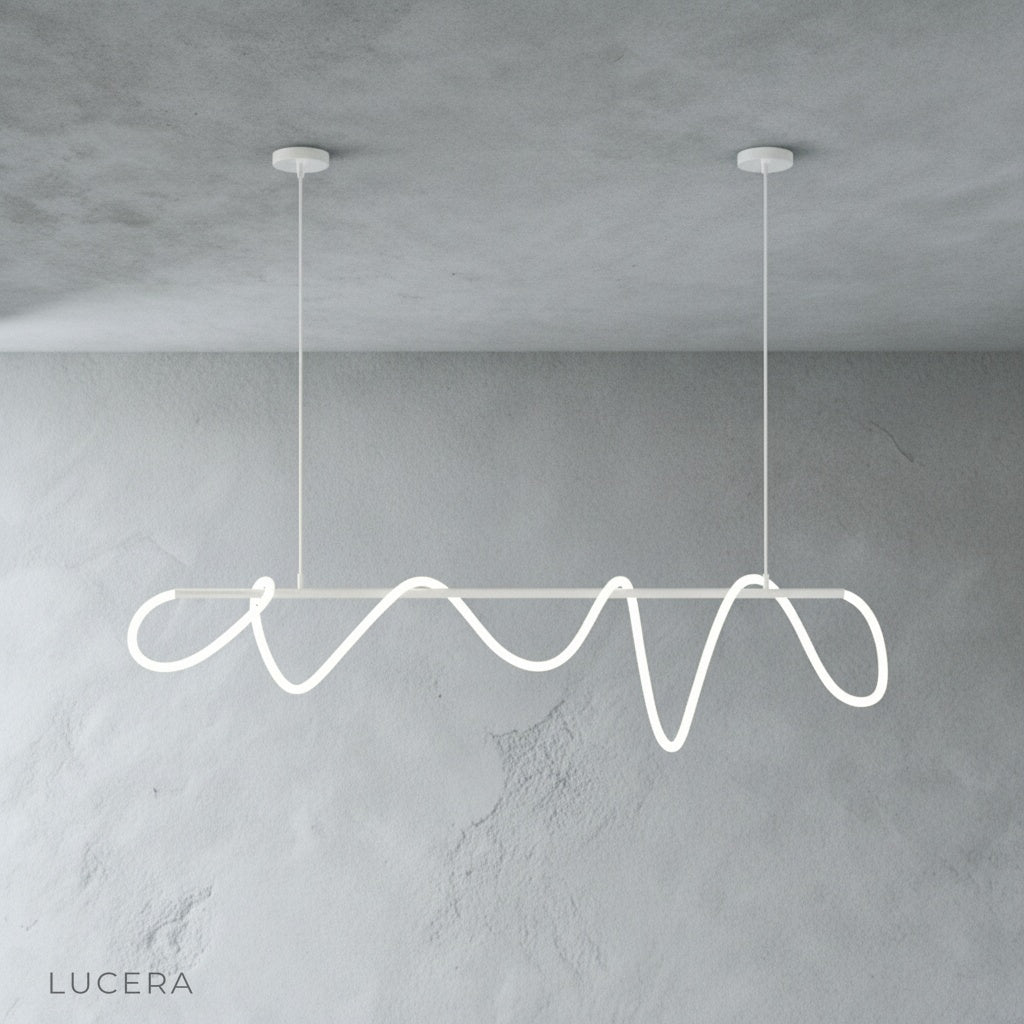 black metal cable chandelier with looped LED tube in bright airy space