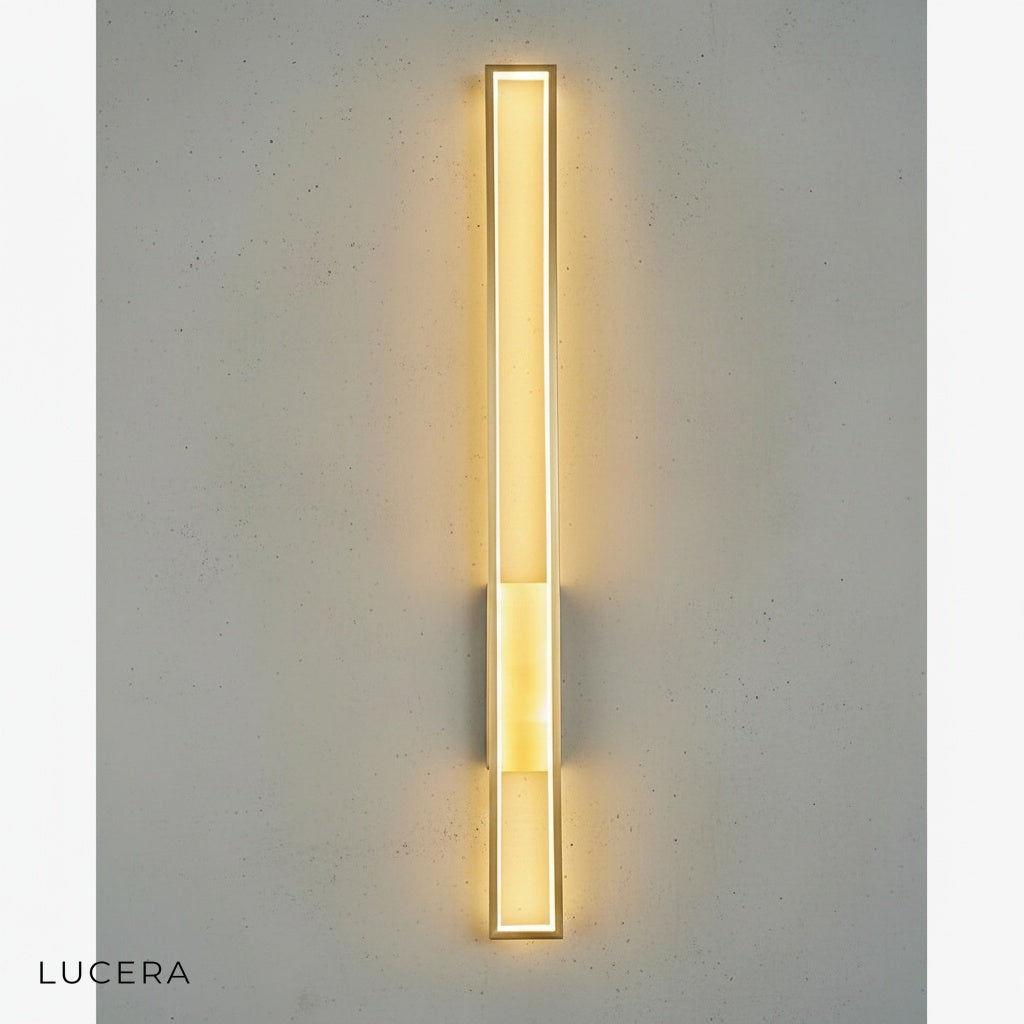 gold finish variant of retro LED wall sconce mounted on dark wall in minimalist interior