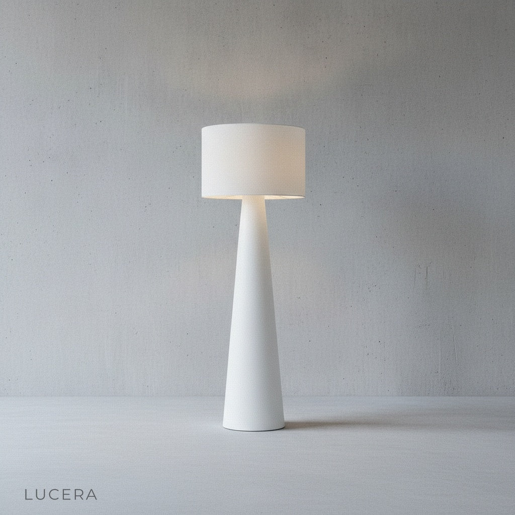 Quarters Floor Lamp turned on at dusk casting non-glaring light across a bedroom reading nook with wooden floor