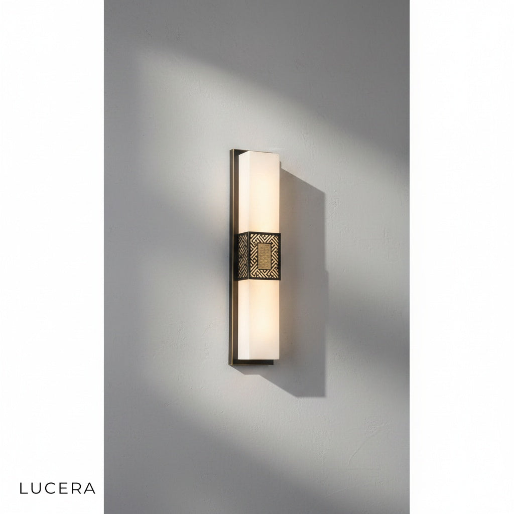 elegant Choral sconce mounted above a bathroom vanity with warm 3000K glow