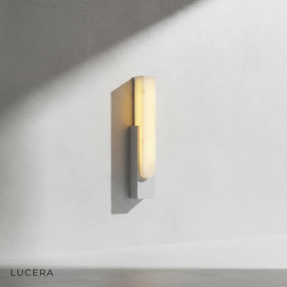 detail shot of Rumore lamp's sleek rectangular silhouette against wall
