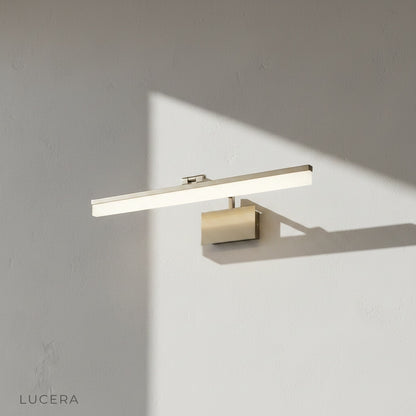 balance wall lamp illuminating contemporary bathroom mirror with warm glow