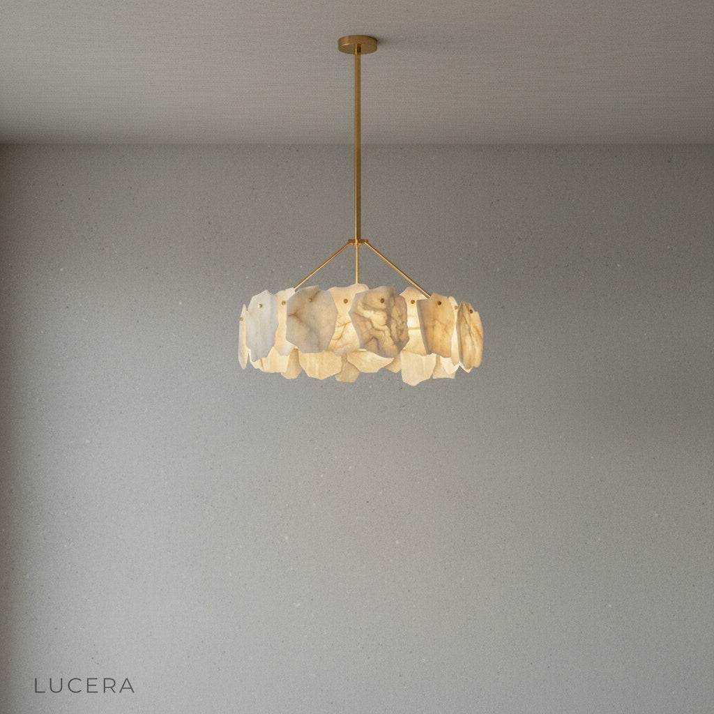 Spindle Alabaster Chandelier hanging above dining table in neutral interior