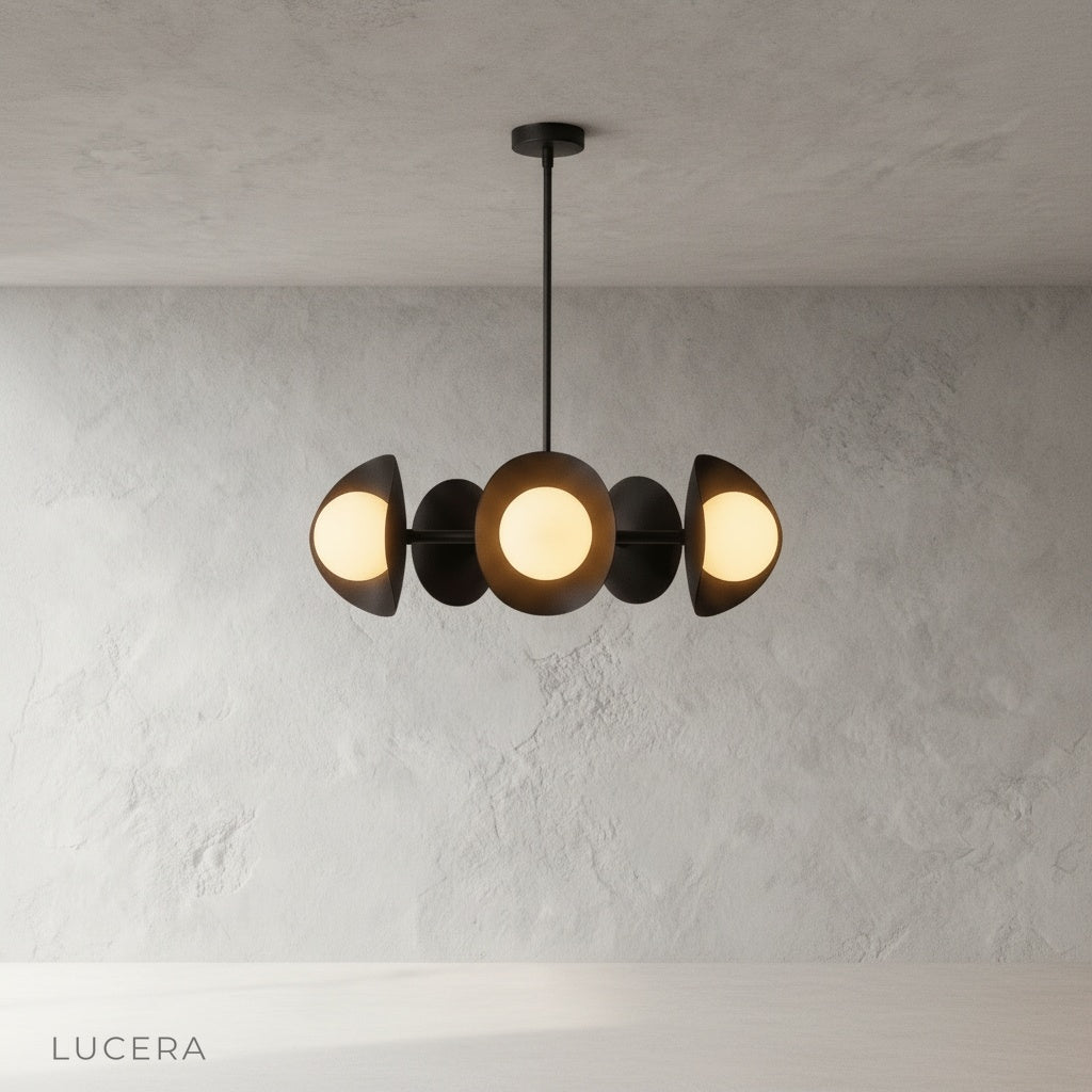 Lambrusco Chandelier with warm ambient light glowing above a kitchen island