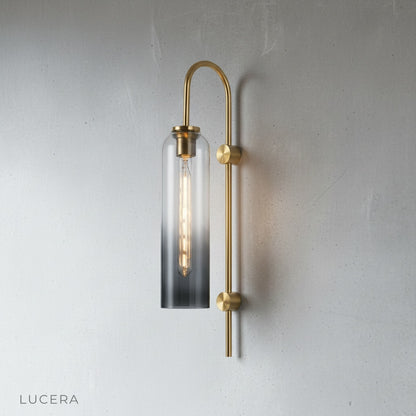 minimalist wall sconce above a bedside table with warm ambient light
