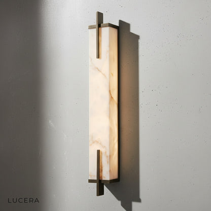 Amalfi iron wall sconce paired with wooden console in modern Asian interior