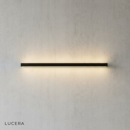 angled studio view of Staccato Bookshelf LED Wall Lamp with color-changing LED strip in blue mode