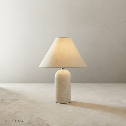 Xerophytic Table Lamp glowing on bedside table in cozy bedroom at dusk