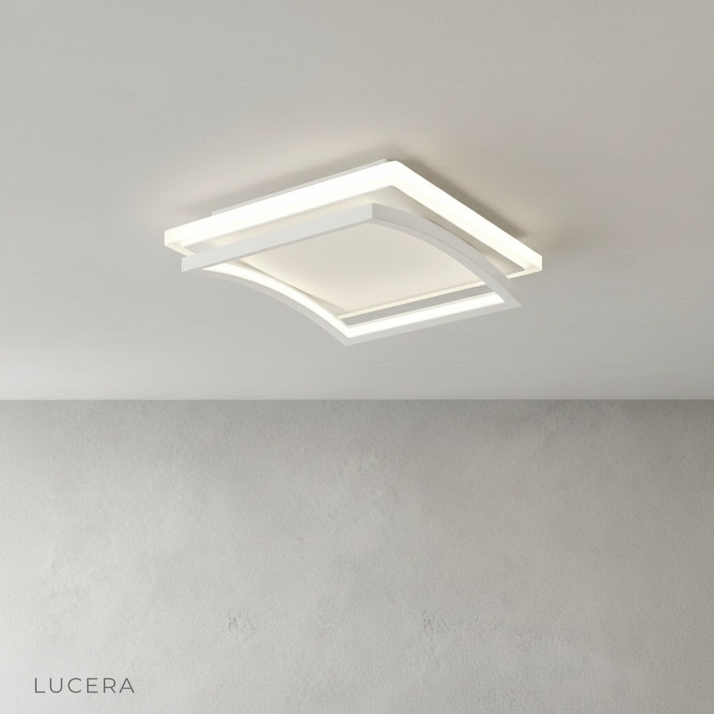 contemporary broom ceiling light illuminating kitchen island with soft white light