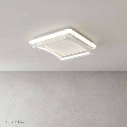 contemporary broom ceiling light illuminating kitchen island with soft white light