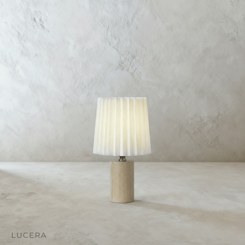 Pandora Table Lamp on rustic oak nightstand beside reading chair with open book and warm ambient glow