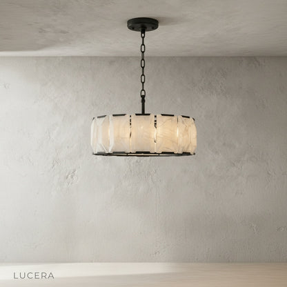 Detail view of Vivid Round Chandelier top canopy and suspension cables against white ceiling