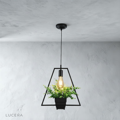 Keep Pendant Light in brushed brass finish hanging over a cozy bedroom nightstand