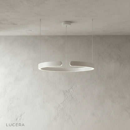 ring chandelier glowing warm white in cozy dining room setting
