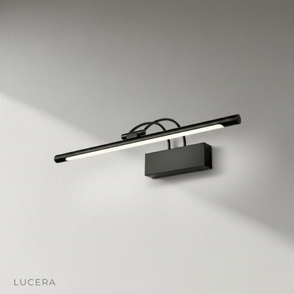 contemporary wall sconce with PC diffuser casting warm light in entryway