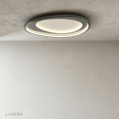 Tantalus contemporary ceiling light in minimalist bedroom with soft evening glow