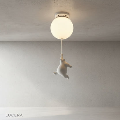 Lintel ceiling light glowing warmly above toddler bed at night