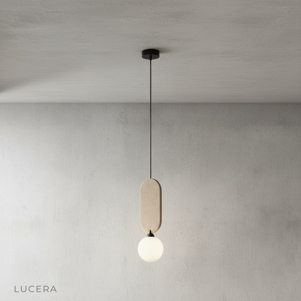 Karat pendant lamp glowing softly above wooden office desk in daytime