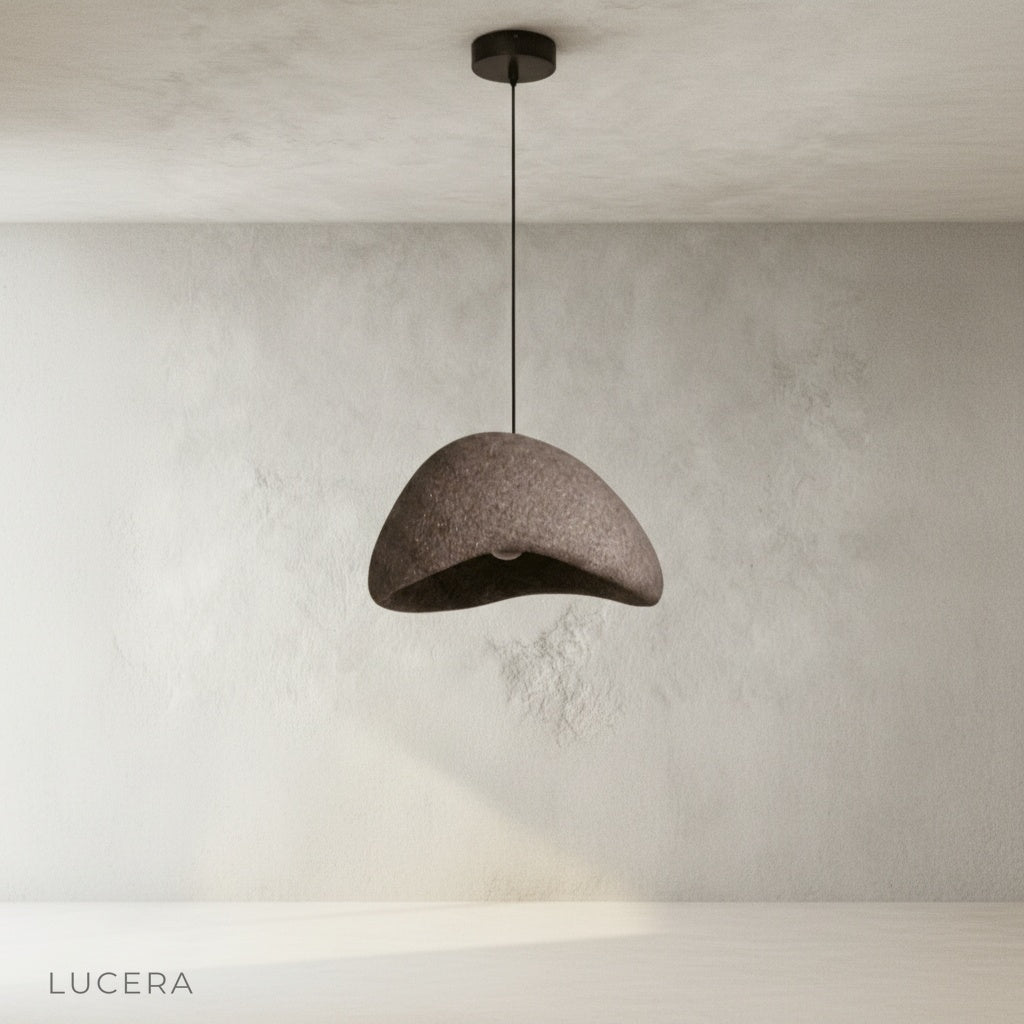 sand pendant light in minimalist bedroom with soft warm lighting