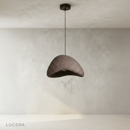 sand pendant light in minimalist bedroom with soft warm lighting