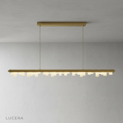 Black aluminum frame and frosted acrylic diffusers of the Fascinating Pendant Light in a studio setting