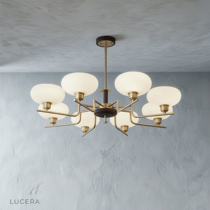 Eronix chandelier with three lights installed above a cozy breakfast nook with natural light