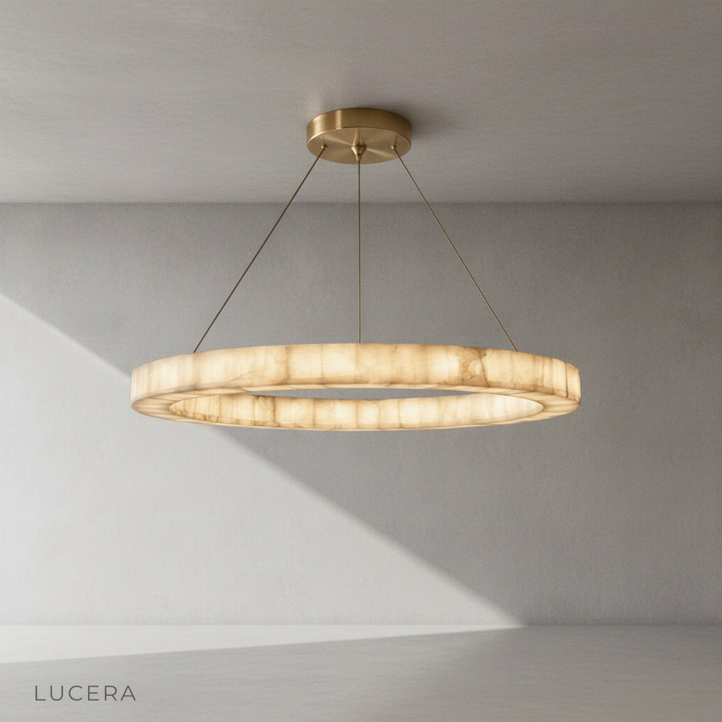The chandelier lit from within, showcasing the translucent alabaster veins and organic stone patterns