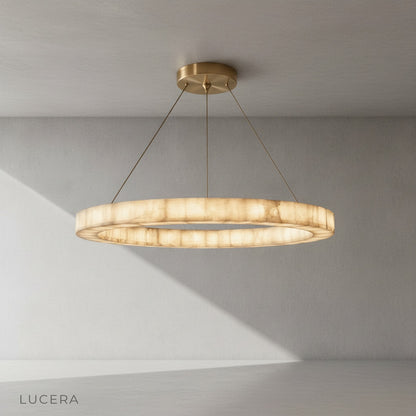 The chandelier lit from within, showcasing the translucent alabaster veins and organic stone patterns