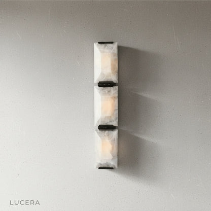 Detail view of Haut-Médoc lamp's brass mounting bracket and stone seam