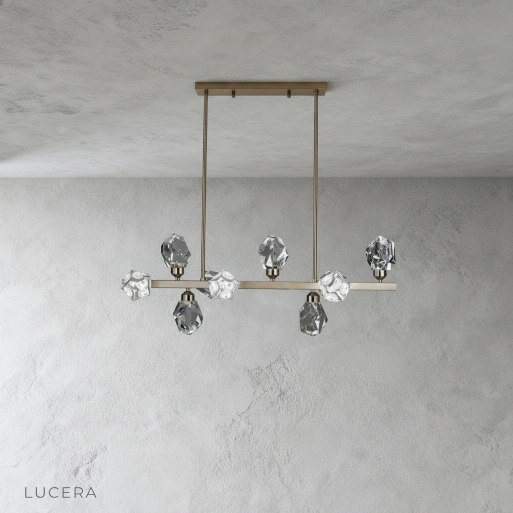 cassia chandelier hanging in elegant dining room with warm ambient lighting and crystals sparkling