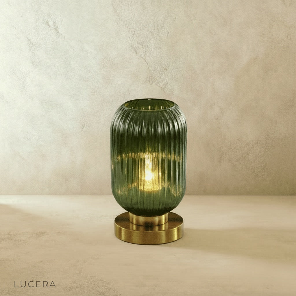 eclat table lamp glowing softly on marble sideboard in modern hallway