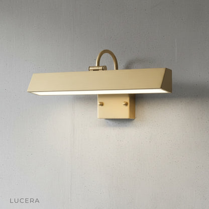 Quiete wall lamp in matte black finish against a gray stucco wall