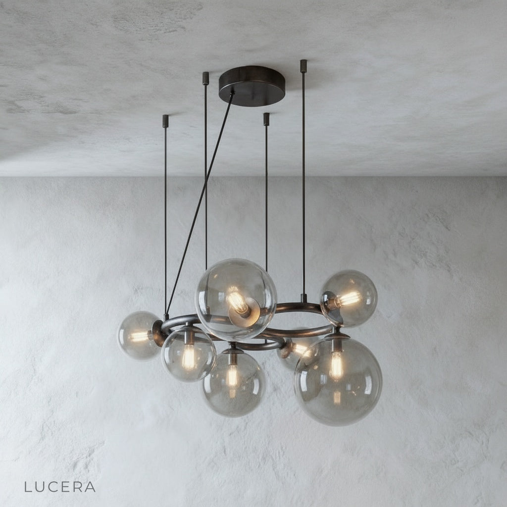 Grenache chandelier hanging in entryway with soft ambient lighting